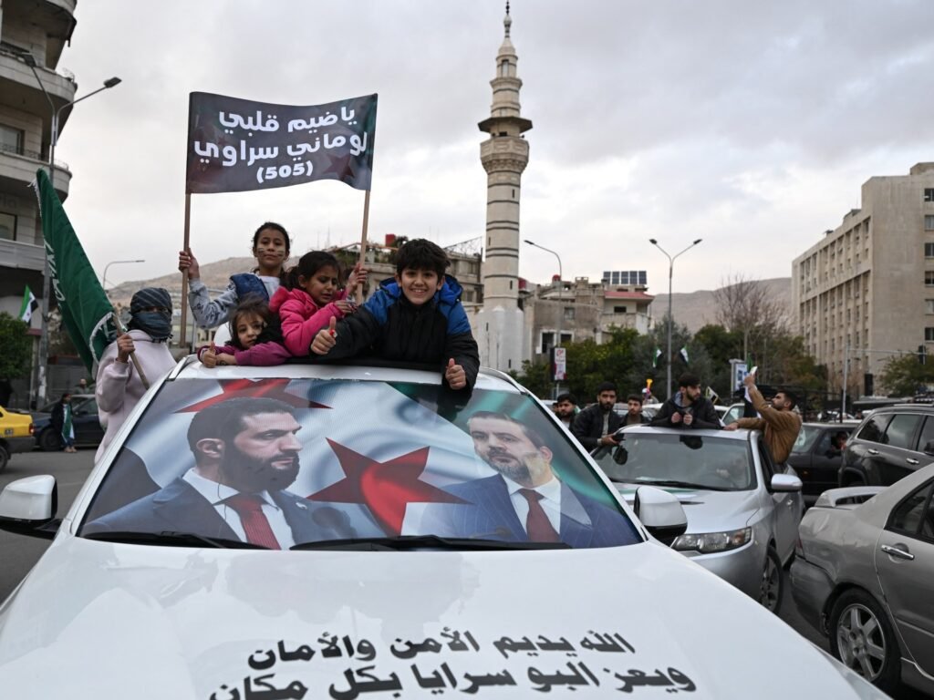 With flags and fireworks, Syrians celebrate one year since fall of al-Assad | Syria’s War News